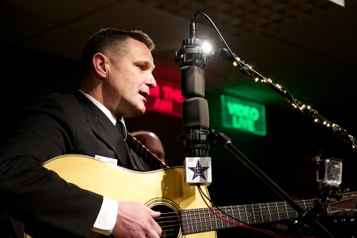 Image of a Seaman Playing the Guitar and Singing